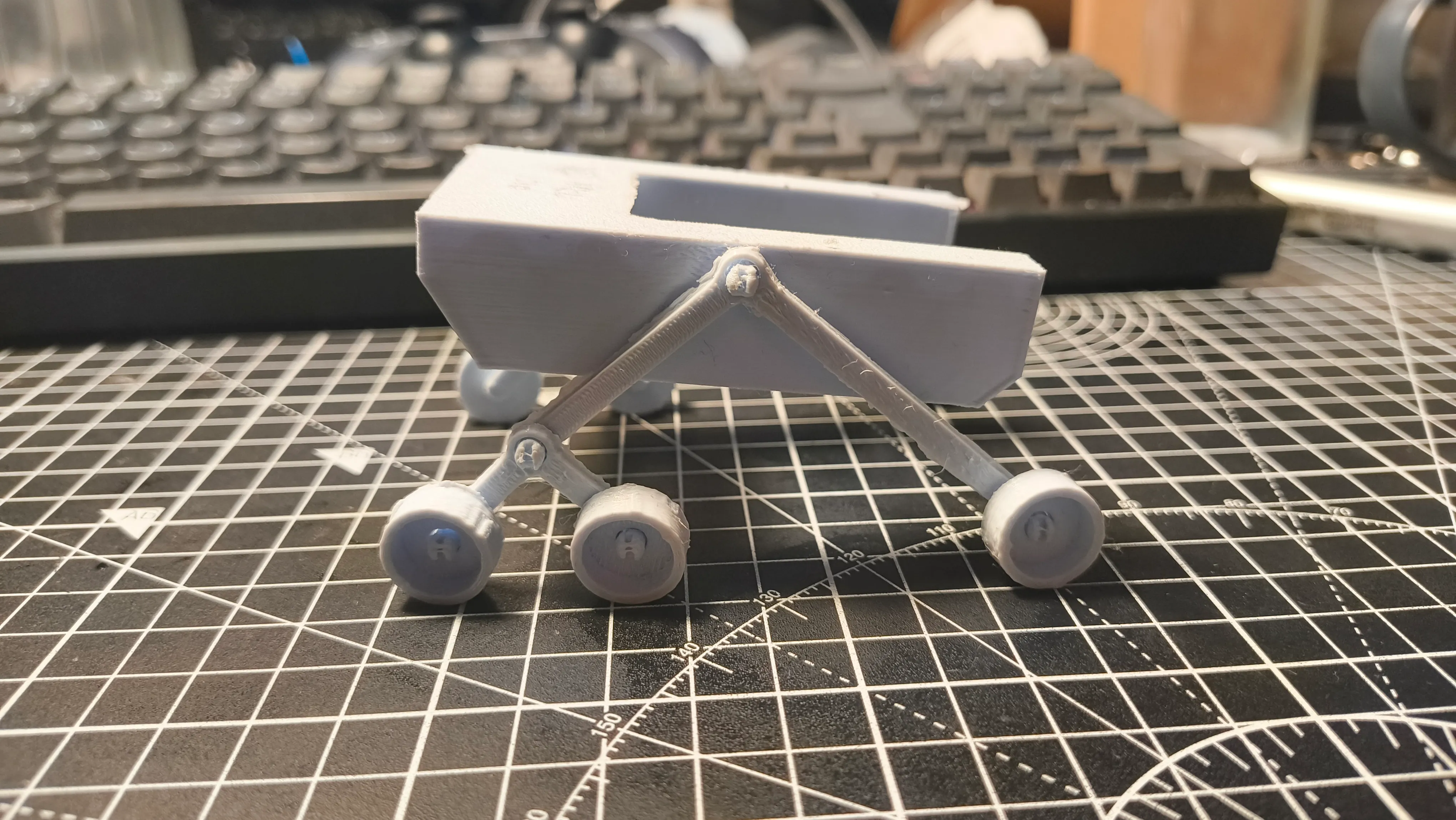 1:10 scale model of the N.E.I.L. rover showing rocker-bogie suspension