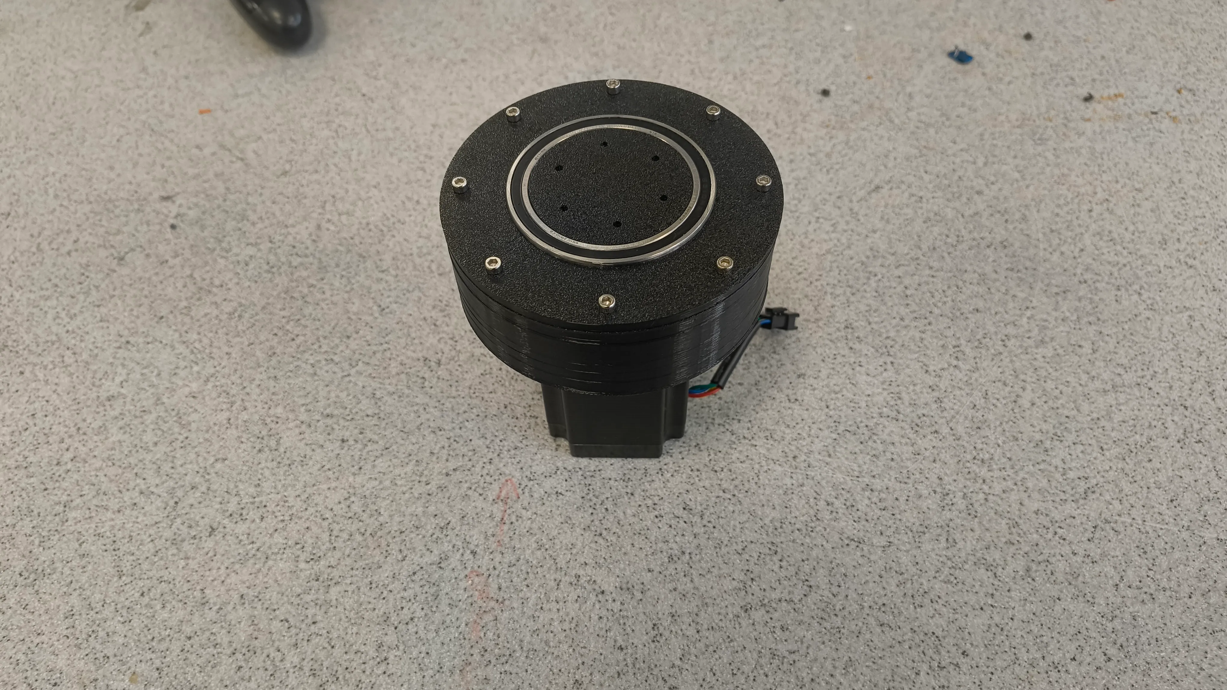 Reducer assembly — top view showing bearing and mounting bolts